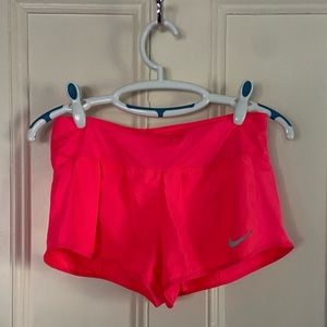 Nike Dri-Fit running shorts in size medium - neon pink